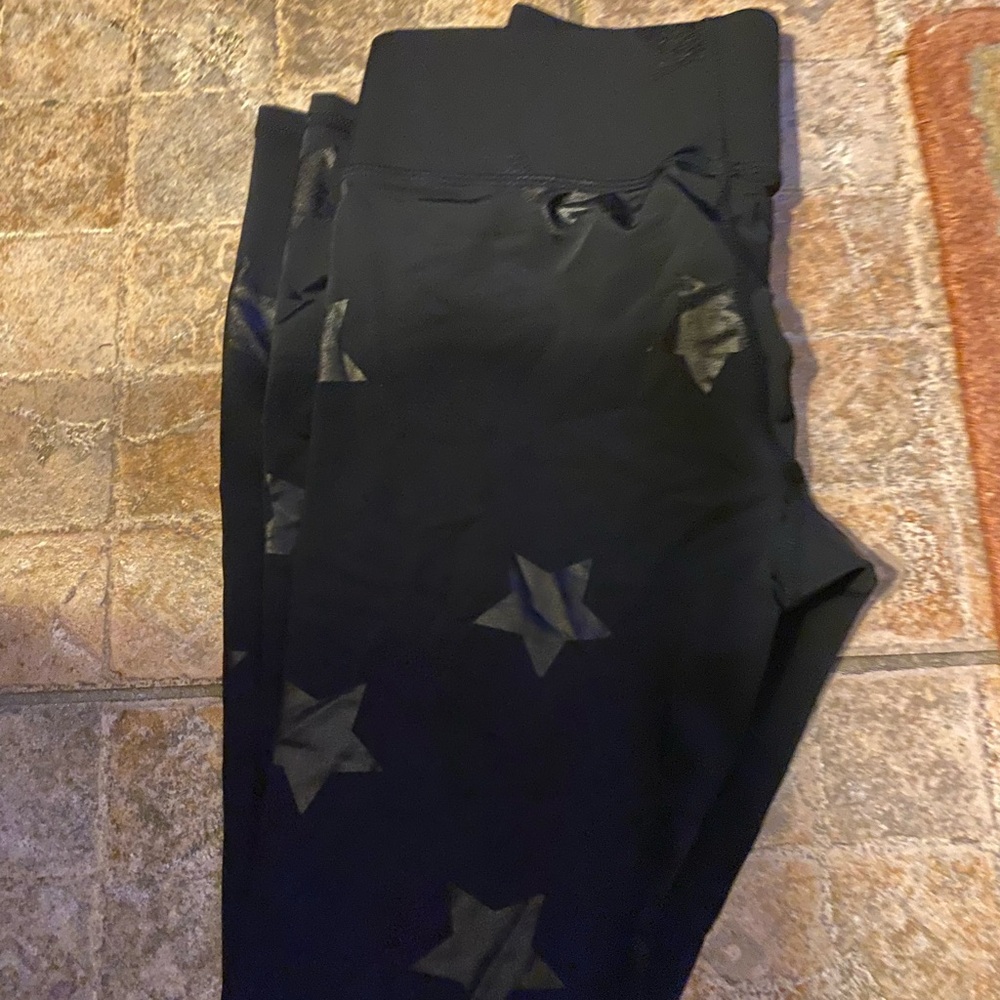 Gently used Terez leggings in foiled star print. E